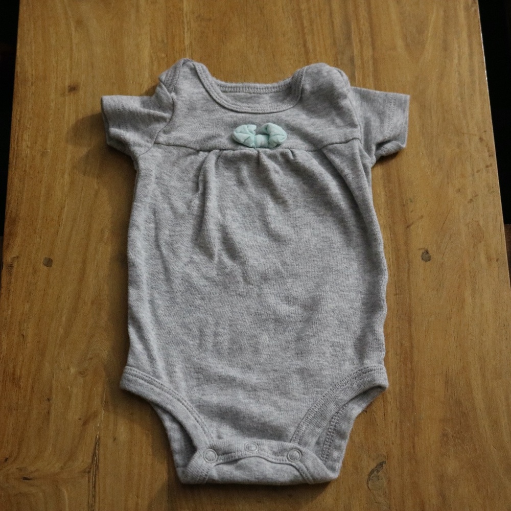 Grey bodysuit with a bow